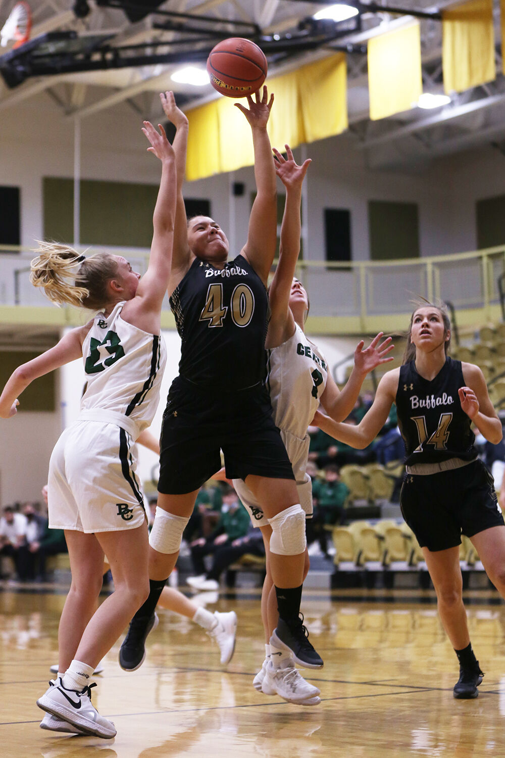 Danica Boyce jumps for a rebound during the first quarter